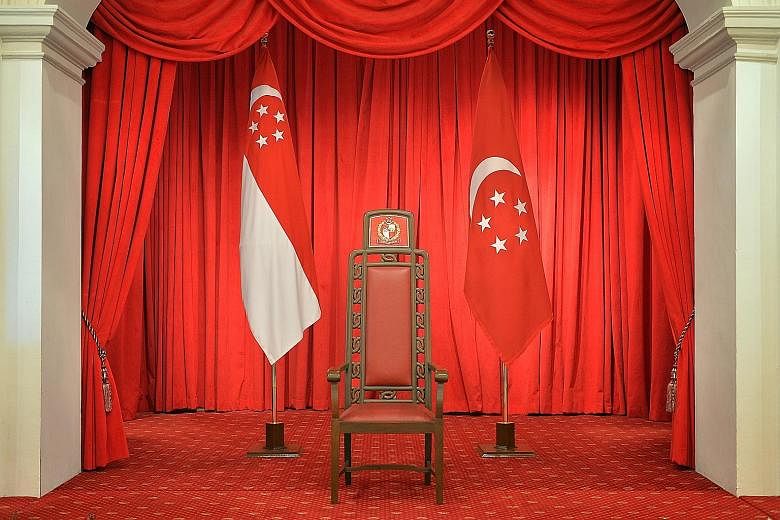 The President's chair, flanked by the state flag and the presidential flag, at the Istana. The elected presidency is needed to "stabilise the political system", says PM Lee.