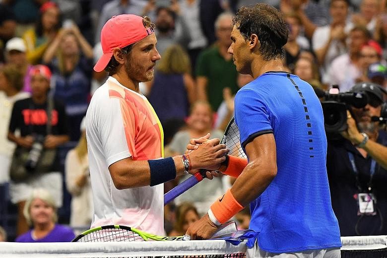 Underdog Pouille (left) beat Nadal in their fourth-round encounter at Flushing Meadows on Sunday.