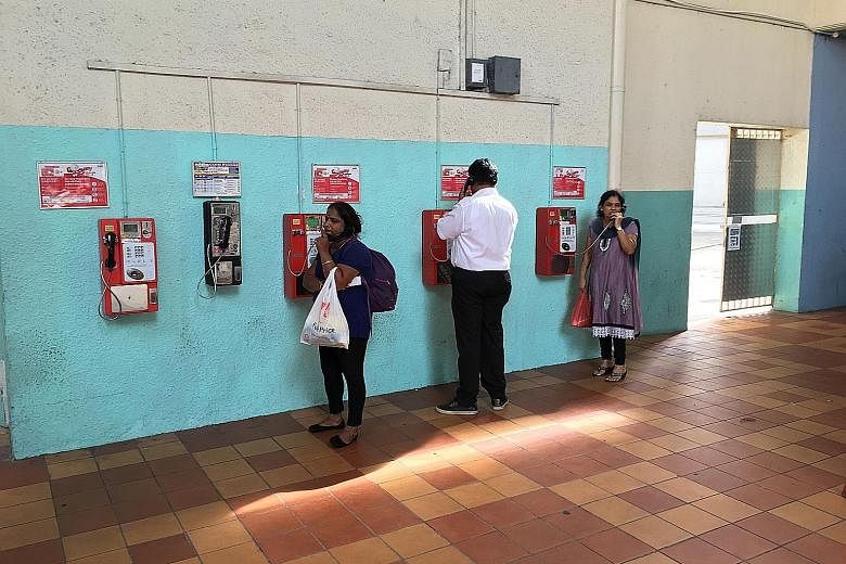 About 25 people were seen using the payphones in Tekka Centre in five hours. Some needed a payphone because the batteries in their mobile phones had run out, while others had forgotten to take their phones.