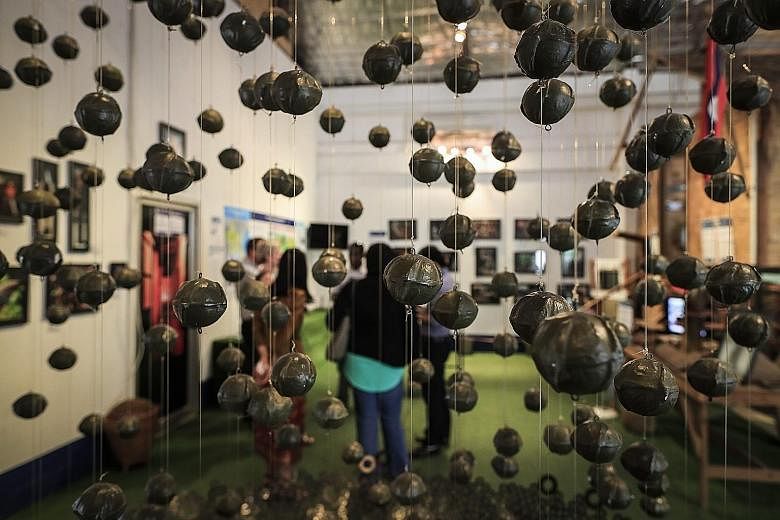 Cluster bombs on display at the Cooperative Orthotic and Prosthetic Enterprise (Cope) Centre in Vientiane. Cope provides those injured by unexploded ordnance with access to orthotic and prosthetic devices. During the Vietnam War, the US dropped 2.7 m