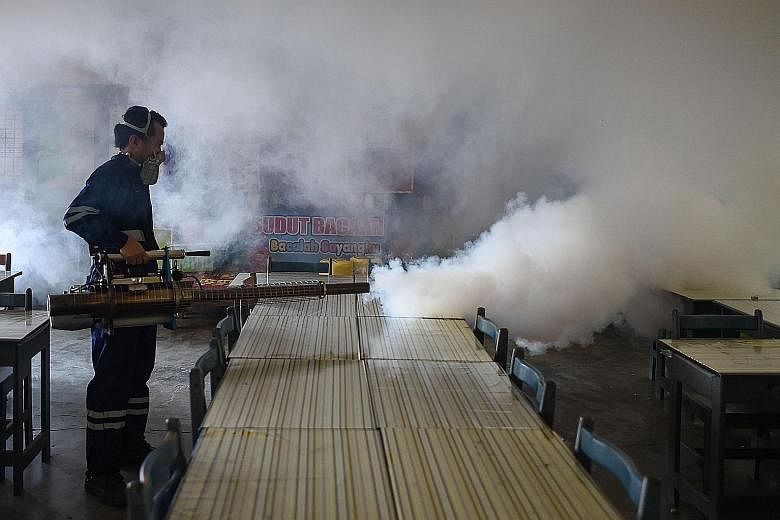 A school classroom being fumigated on the eve of the annual national Primary School Evaluation Test in Kuala Lumpur on Sunday. Malaysia has so far recorded two Zika infections.
