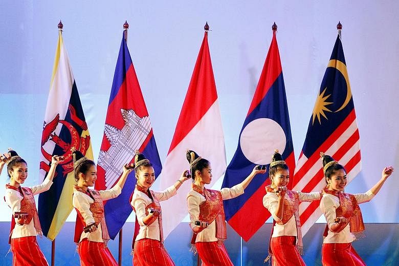 Dancers performing at the opening ceremony of the Asean Summit in Vientiane, Laos, yesterday. The theme for this year's summit is "Turning vision into reality for a dynamic Asean community", where leaders are expected to talk about pressing issues fa