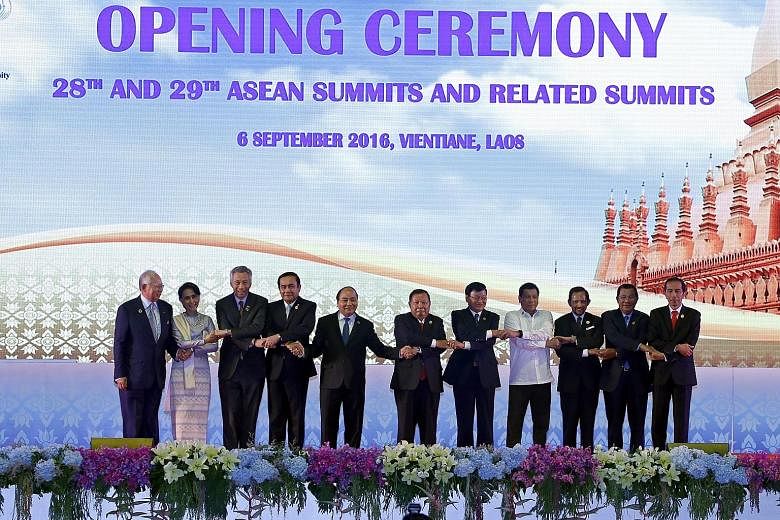 Getting together at the opening ceremony are (from far left) Malaysian Prime Minister Najib Razak, Myanmar State Counsellor Aung San Suu Kyi, PM Lee, Thai Prime Minister Prayut Chan-o-cha, Vietnamese President Tran Dai Quang, Laos President Bounnhang