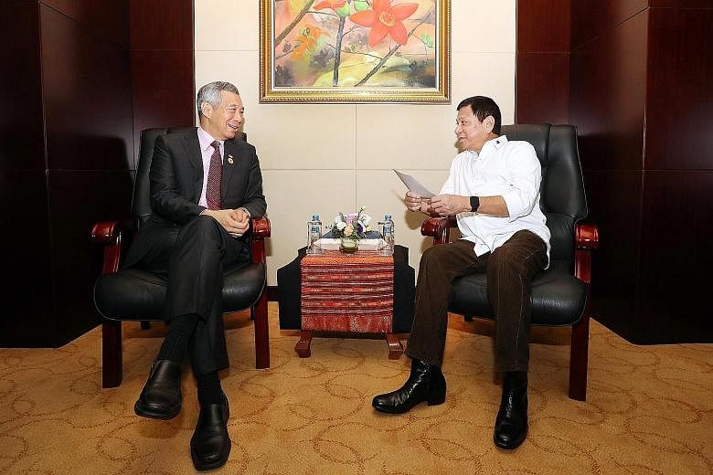 PM Lee meeting Philippine President Duterte in Laos yesterday. They reaffirmed the long and close ties between both countries and looked forward to the celebrations of the golden jubilee of diplomatic relations in 2019.