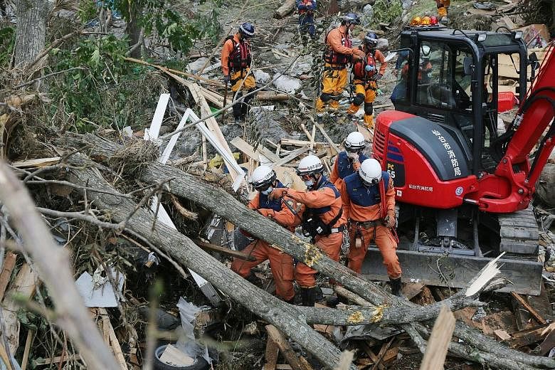 Rescuers search for victims in the wake of Typhoon Lionrock in Japan's Iwate prefecture last week. A US-based study found that a recent rise in storm intensity in East Asia was caused by ocean warming.