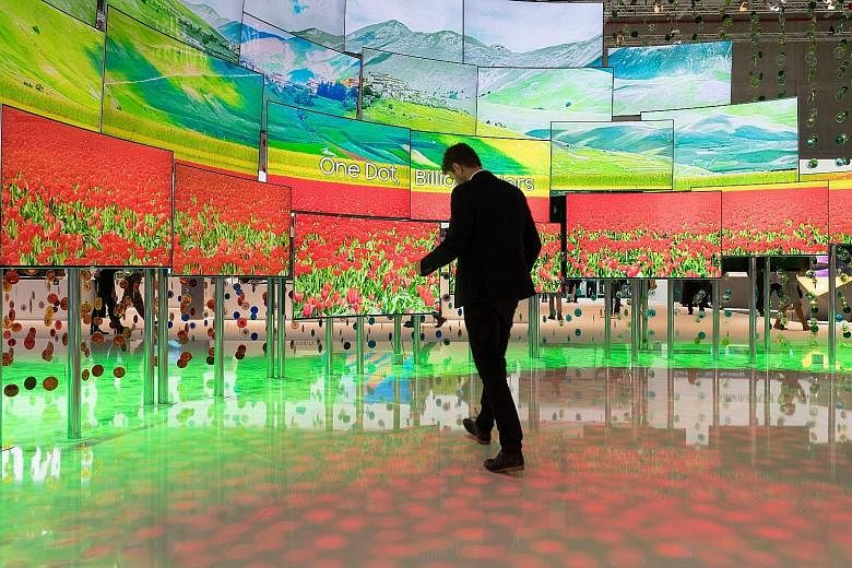 A wall of Samsung TVs with Quantum Dots technology at IFA in Berlin. The fair is the world's biggest for entertainment technology, IT and household appliances. LG's smart fridge has a 29-inch Windows 10 tablet as one of its doors. Among the fridge's 
