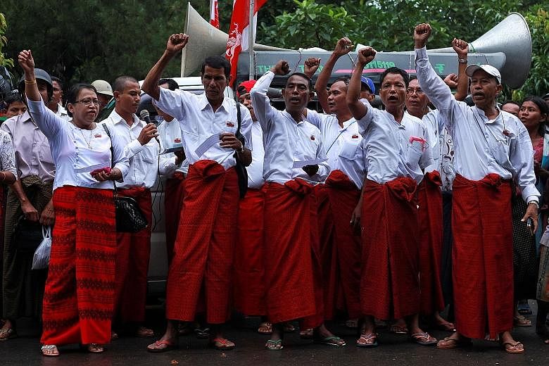 Buddhist protesters rallying against former UN chief Kofi Annan yesterday as he arrived in the troubled Myanmar state of Rakhine. Mr Annan has been tasked by Myanmar's de facto leader Aung San Suu Kyi to head a commission charged with finding ways to