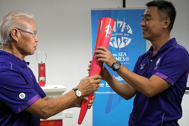 Toh Boon Yi, holding the SEA Games torch, said his team at the Singapore Sports Institute will help him to "continue the strong foundation established... and strengthen Singapore's high-performance pathway".