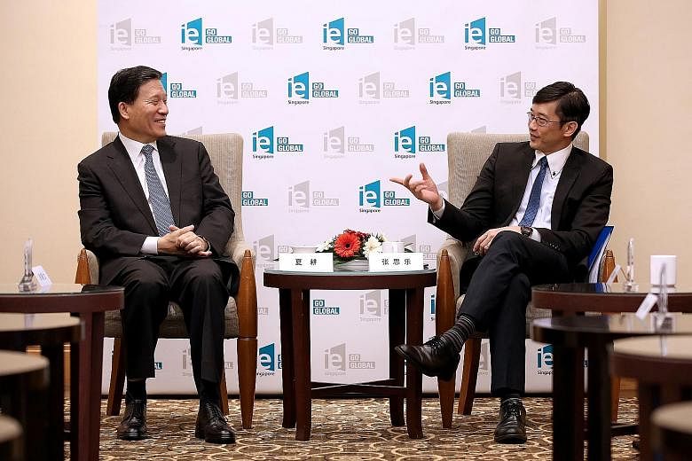Minister of State for Manpower Teo Ser Luck (right) and Shandong Vice-Governor Xia Geng at the 19th Shandong- Singapore Business Council meeting yesterday. Mr Teo said there are opportunities for Singapore firms to tap emerging services sectors in Sh