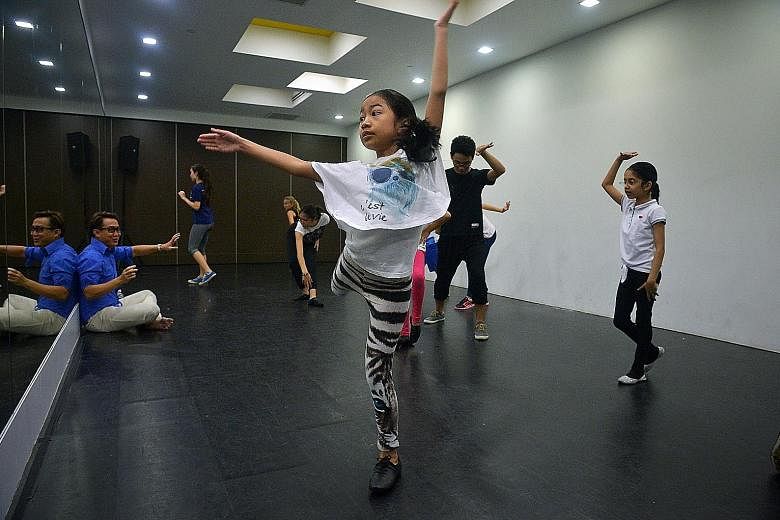 Singapore Chinese Girls' School pupil Regina Laletha (centre), 12, practising basic choreography with other participants at a ChildAid workshop.