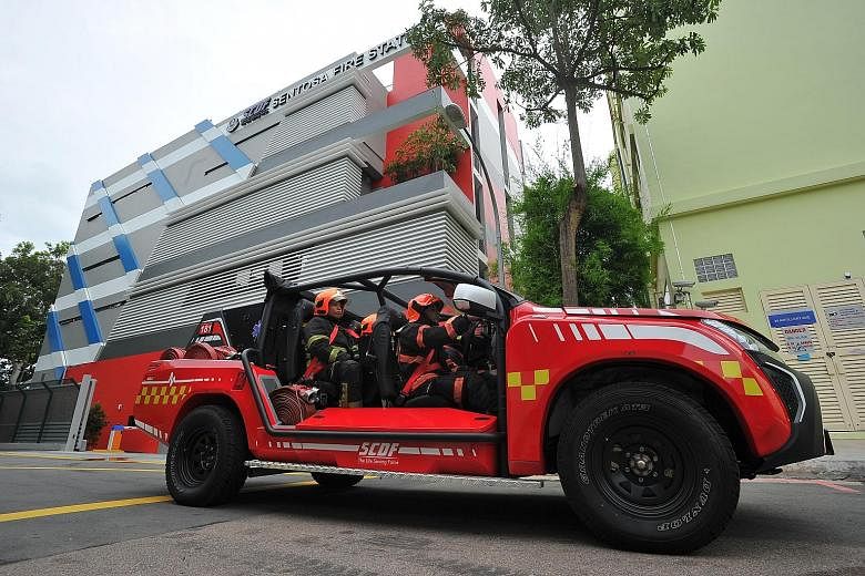 SCDF personnel in a Red Rhino at Sentosa's first fire station yesterday. The station has 20 personnel ready to be deployed at any one time, and houses two fire engines, a fire bike, an ambulance and a support vehicle.