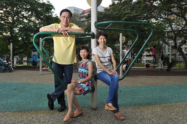 Taxi driver Kan Siew Luen, his wife, Madam Lai (centre), a China national who works as a hotel room attendant, and Care Corner volunteer Ms Chua, who was Madam Lai's local buddy in a one-year programme.
