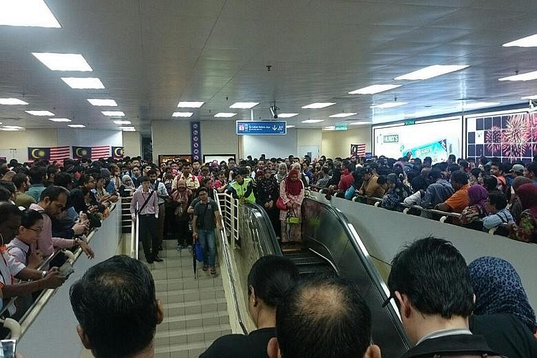 Commuters crowding the platform while waiting for trains to arrive at the Masjid Jamek LRT station in the Malaysian capital of Kuala Lumpur yesterday morning after a power trip caused a disruption. This happened at about 7am between Masjid Jamek and 