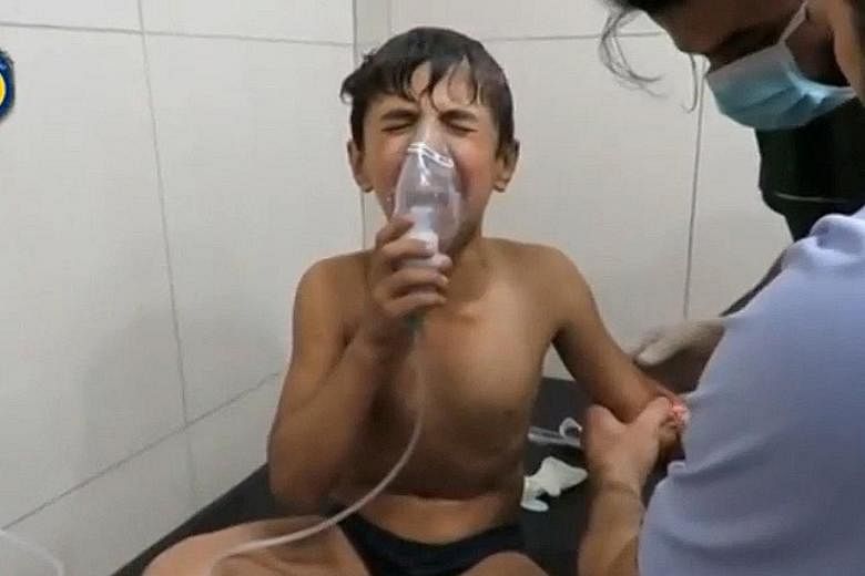 A screen grab of a video posted on social media said to be shot in Aleppo's Sukkari neighbourhood on Tuesday shows a boy in a hospital breathing through an oxygen mask after a suspected chlorine gas attack.