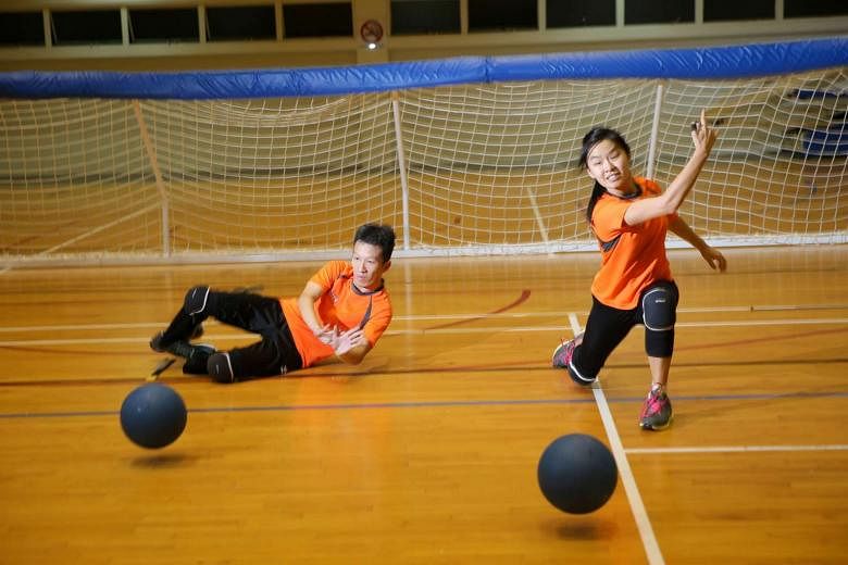 Stephan Chen, 33, (left) and Inez Hung, 24, (right) playing goalball. They picked up the sport after the Asean Para Games last year. They represent the new wave of disabled people taking part in para sports. 