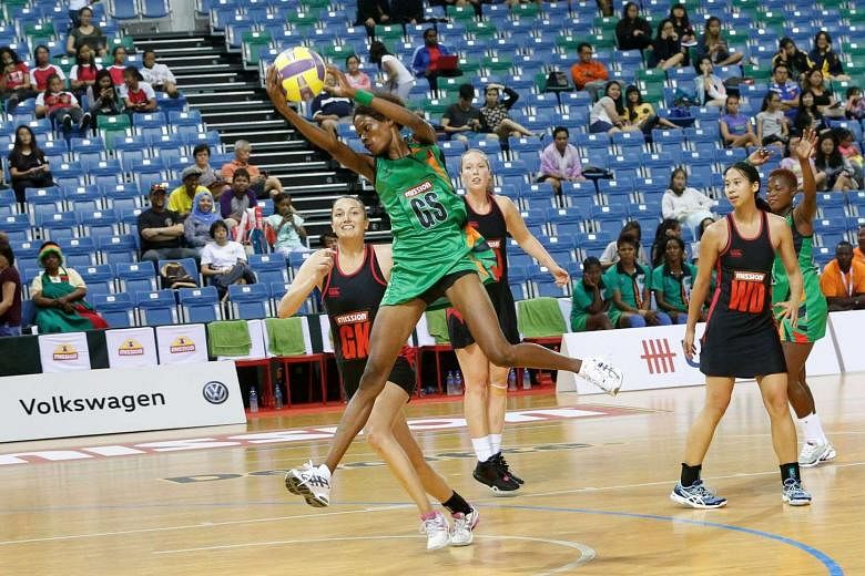 Zambia goal shooter Hellen Banda catches a ball during the Mission Foods Nations Cup match against Canada     yesterday. Banda, 25, shot 52 out of 53 attempts during Zambia's 78-26 victory. 