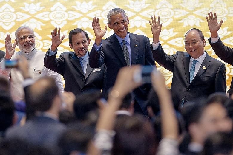 (From left) Indian Prime Minister Narendra Modi, Brunei Sultan Hassanal Bolkiah, Mr Obama and Vietnamese Prime Minister Nguyen Xuan Phuc were among the leaders at the 11th East Asia Summit in Vientiane, Laos, yesterday.