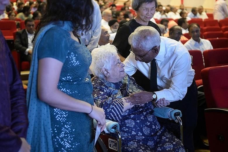 Former Cabinet minister S. Dhanabalan greeting Mr S R Nathan's wife, Madam Urmila Nandey, at a tribute session by the Indian community for the former president who died on Aug 22. One of seven speakers who gave eulogies at the event yesterday, Mr Dha