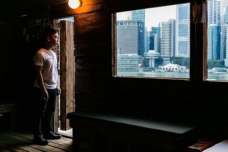 Actor-director Oliver Chong ponders life together with his audience in a wooden cabin.