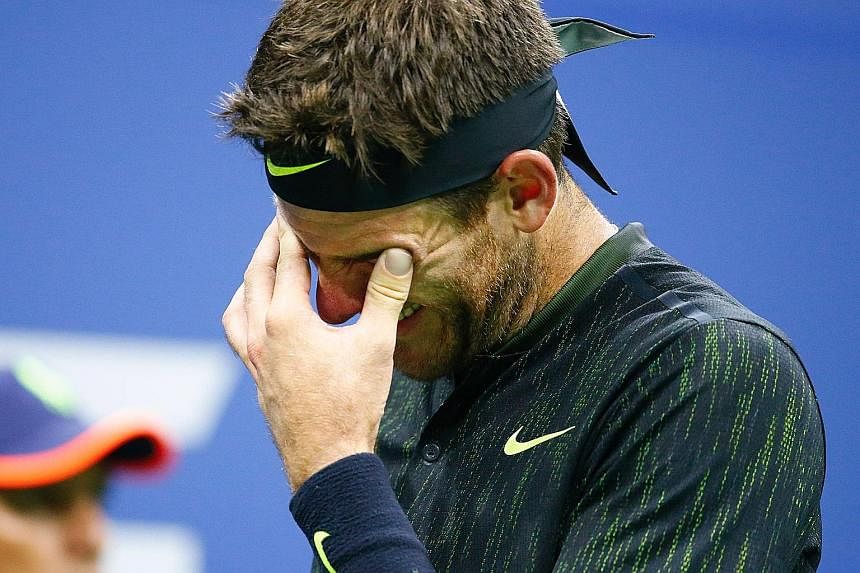 Left: Kei Nishikori celebrating a point against Andy Murray in their US Open quarter-final. The Scot felt that the tide changed when the rain came and the roof was closed, which helped his rival return better. Below: Juan Martin del Potro is moved by