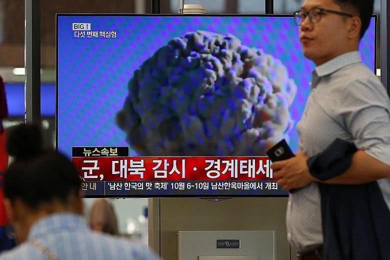 A TV news broadcast at Gimhae International Airport in Busan, South Korea, on a powerful nuclear test by North Korea yesterday. A shallow 5.3-magnitude earthquake was detected near North Korea's nuclear test site, pointing to a fifth atomic test. Pyo