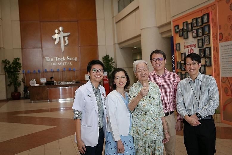 Madam Cheng, 95, with (from left) TTSH's senior dietitian Ong Yawei; nurse clinician Kitty Ho; Dr Jonathan Tan, senior consultant for the department of anaesthesiology and head of the surgical intensive care unit; and Dr Fong Sau Shung, consultant fo