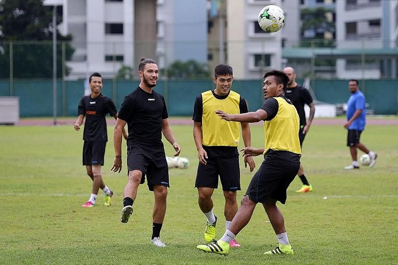 Tampines Rovers' Hafiz Abu Sujad (centre) training with his team-mates yesterday ahead of their game with Home United. The national midfielder is raring to go against the Protectors after playing for the Lions in Bahrain last week.