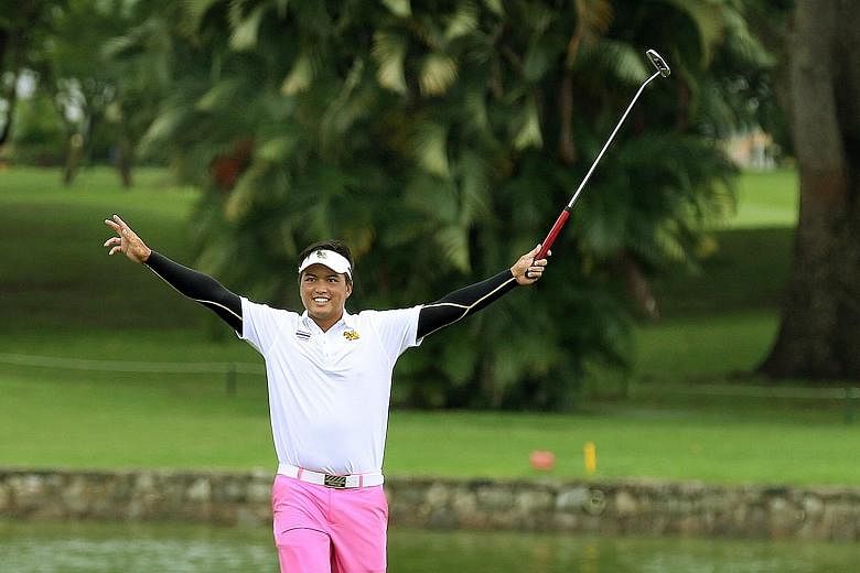 Thailand's Napong Sriparsit celebrating a birdie on the 18th hole on the final day of the Putra Cup yesterday. He carded a three-under 67 for his best round of the four-day tournament, finishing sixth overall in the individual standings.