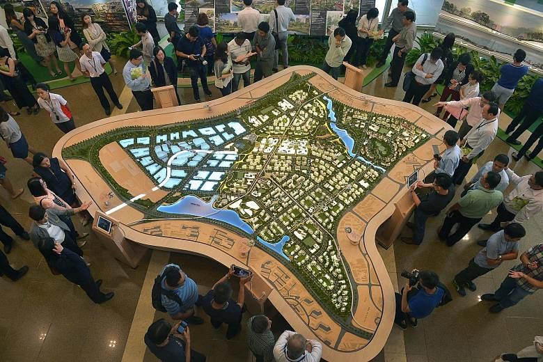 Visitors checking out the Tengah exhibition at the HDB Hub in Toa Payoh yesterday. The first new HDB town since Punggol, Tengah will boast features like a forest corridor, car-free town centre and eco-friendly features.
