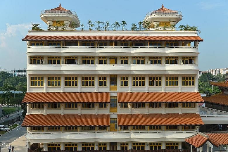 PM Lee at the official opening of the building and 10th anniversary celebration of the Buddhist College of Singapore yesterday. The six-storey building (below) within the Kong Meng San Phor Kark See Monastery compound in Bright Hill Road consists lar