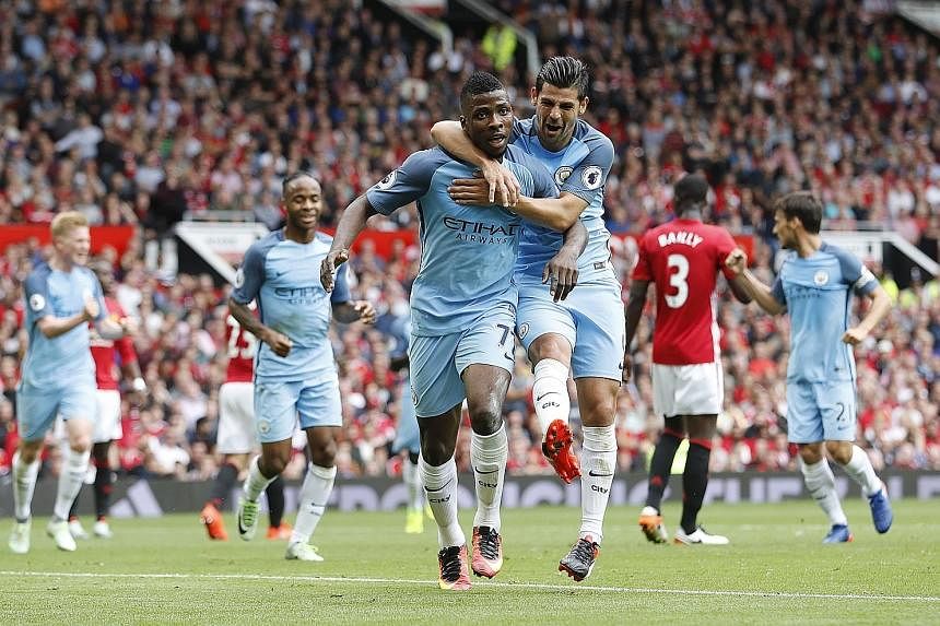 Top: Manchester City's Kelechi Iheanacho (left), celebrating with Nolito, more than filled in for the suspended Sergio Aguero by scoring his side's winner. A crestfallen Jose Mourinho sharing an embrace with old enemy Pep Guardiola (right) after the 