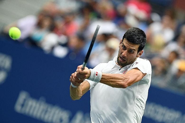 Novak Djokovic returning a shot in his semi-final victory over Gael Monfils. The Serb overcame Monfils' efforts to put him off, dispatching him in four sets to reach the final where he will face Stan Wawrinka.