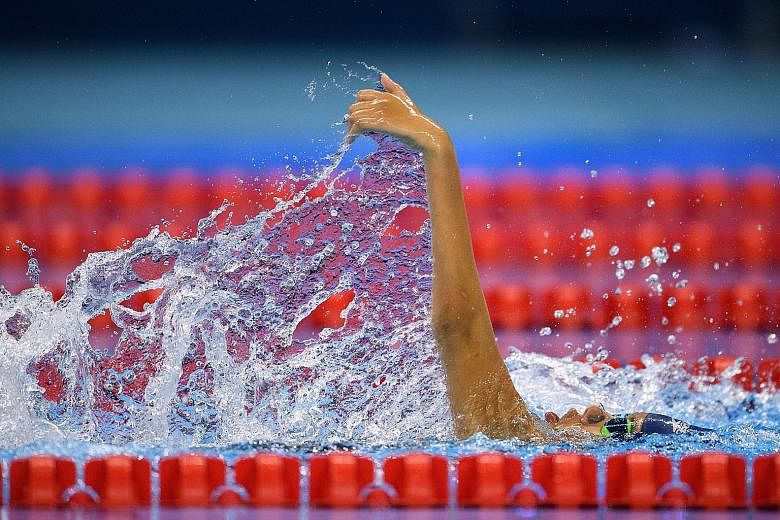 Yip Pin Xiu on her way to clinching gold and shaving 2.7sec off her world record in the 100m backstroke (S2) final at the Olympic Aquatics Stadium in Rio.
