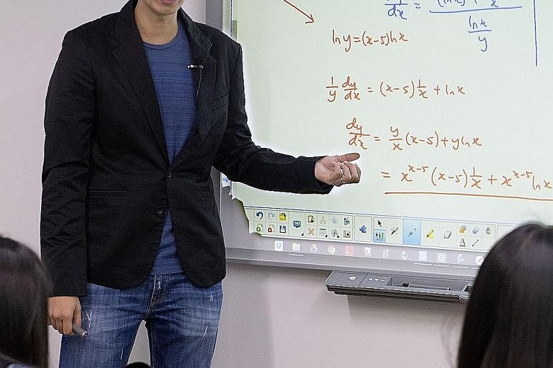 Mr Ang conducting a mathematics class for junior college students. He encourages students to create their own study notes, and, like other educators, said that studying on the day before an exam is too late.
