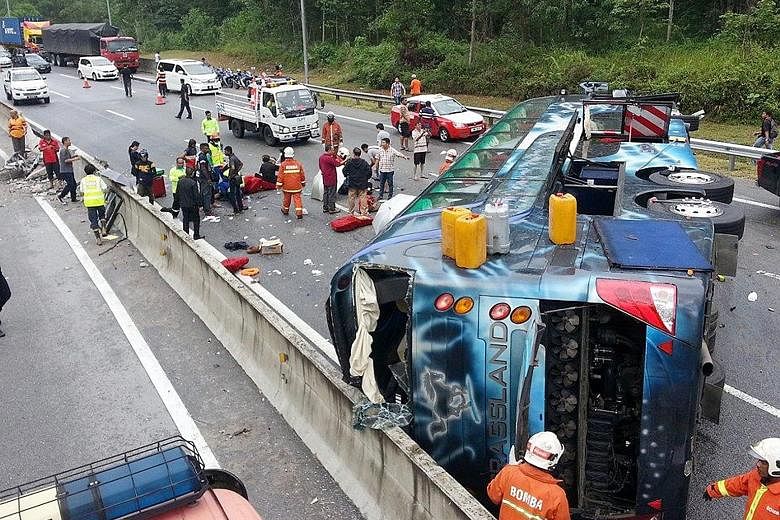 The scene of the Aug 31 Genting bus crash that killed one Singaporean and left nine injured. The bus, which was on the way to Singapore from Genting Highlands, crashed into a road divider and overturned on the highway linking Karak, Pahang, and Kuala