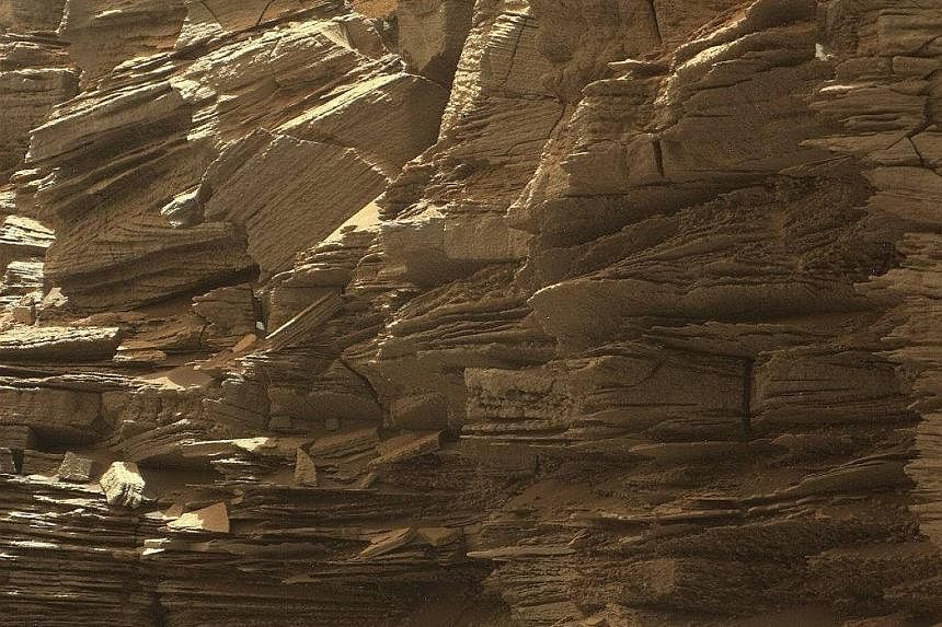 New images of the surface of Mars have been released by US space agency Nasa, and may help scientists understand how the planet's landscape, once favourable for life, changed into the current uninhabitable conditions. The colour photos, taken by the 