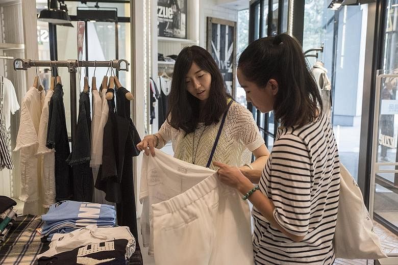 Ms Wu Jingjing (left) shopping with her friend, Pengpeng, in Beijing. Ms Wu, who works at an Internet company, says young Chinese no longer just want someone to marry, they want a relationship based on love.