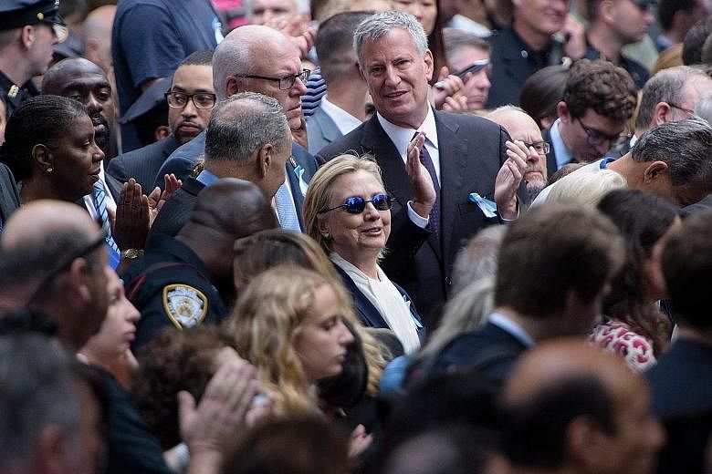 Mrs Clinton at the Sept 11 memorial service in New York on Sunday, which she had to leave abruptly after suffering from dehydration. The 68-year-old's doctor said she had been experiencing a cough related to allergies and was diagnosed with pneumonia