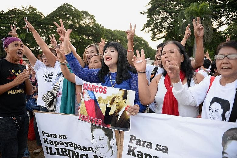 Supporters of late Philippine dictator Ferdinand Marcos after releasing balloons to celebrate his birth anniversary at a park in Manila on Sunday. President Rodrigo Duterte - a Marcos ally - recently reignited squabbles over Mr Marcos' legacy with a 