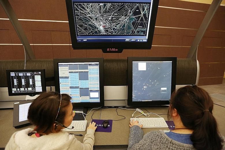 Air traffic controllers at the Singapore Air Traffic Control Centre. Apart from the recruitment drive, CAAS is reviewing processes and procedures, in line with a global ICAO initiative, to reduce fatigue among the staff.