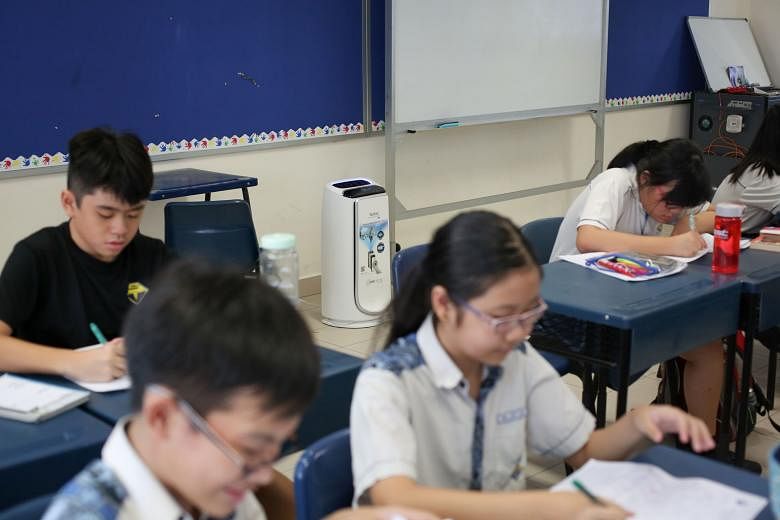 An air purifier in a Primary 6 classroom at South View Primary School. Each classroom has two air purifiers. Some 320 pupils at the school will sit the PSLE this year. Principal Madam Sharida said venues chosen for the exams will allow pupils to continue 