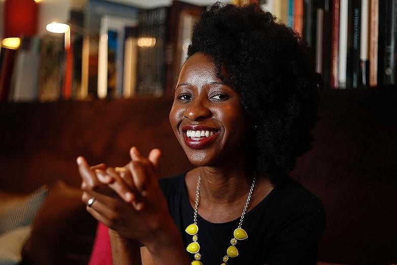 Imbolo Mbue (above) wrote Behold The Dreamers on the kitchen table of her tiny New York apartment while breastfeeding her babies.