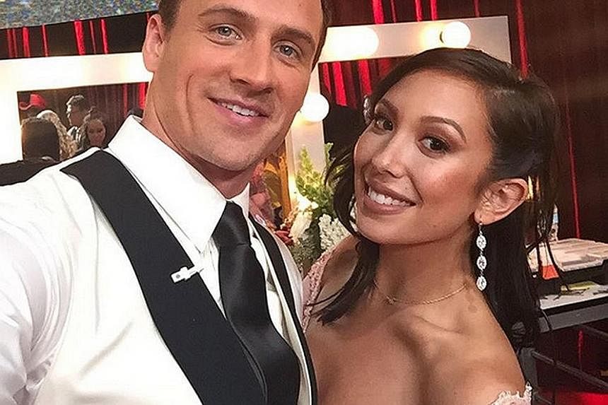 Swimmer Ryan Lochte said he was "a little hurt" while his partner, professional dancer Cheryl Burke, was in tears after protesters stormed the dance floor.