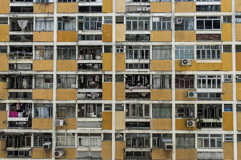 A residential building at a public housing estate in the Shek Kip Mei district in New Kowloon. Hong Kong Chief Executive Leung Chun Ying says there is no scaling down of a public housing project in the New Territories.