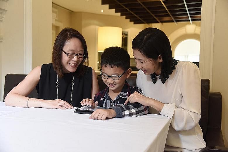 Ms Chua (left), a big believer of children learning through play, put a "six-figure sum" of her own money into developing DetecThink. Madam Ang (right) said the game appeals to her son Ethan, who has been playing the game and has completed it several