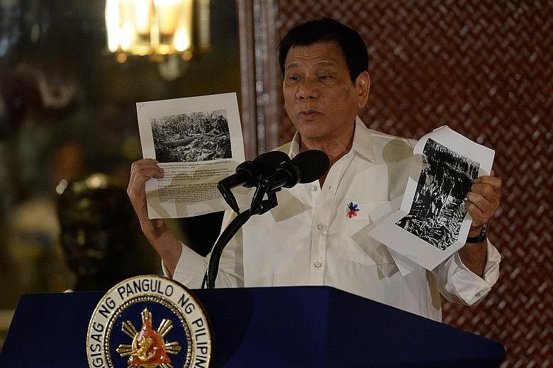 Mr Duterte speaking about the US occupation of the Philippines in the early 1900s in Manila on Monday. "We are not going to cut our umbilical cord to countries we are allied with," he said at an air force event yesterday.