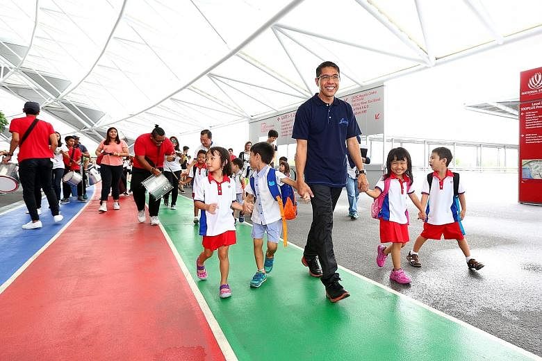South East District Mayor Mohamad Maliki Osman leading the launch of the FairPrice Walk for Rice. Yesterday, recipients of the programme from the Bedok Radiance Senior Activity Centre became the first beneficiaries to earn rice for other underprivile