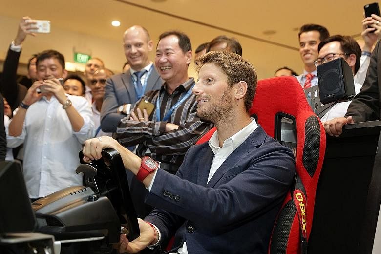 Haas driver Romain Grosjean in an F1 simulator yesterday. The Frenchman is enjoying life at his new team and believes he made the right choice switching from Renault.