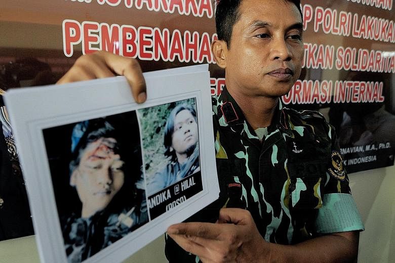 (Above) An Indonesian police spokesman giving details of the joint operation yesterday between the police and the military in which a member of the militant group, the Eastern Indonesia Mujahideen, was killed and its leader Basri (below) was captured