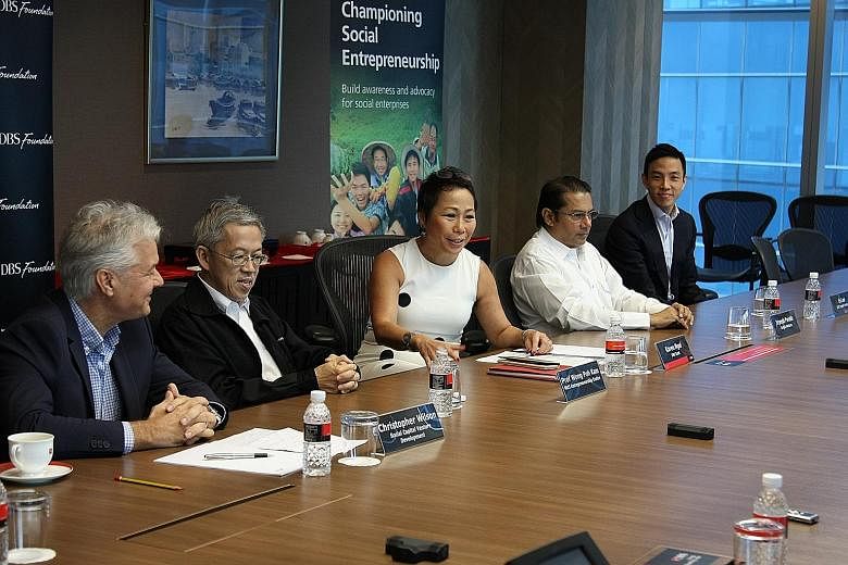 At the round table yesterday are (from left) Water and Healthcare Foundation founder Christopher Wilson; NUS Entrepreneurship Centre director Wong Poh Kam; DBS strategic marketing and communications head Karen Ngui; Jungle Ventures' Mr Parekh; and LG